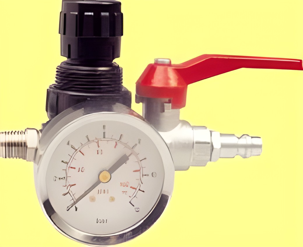 Pressure regulator with pressure gauge.